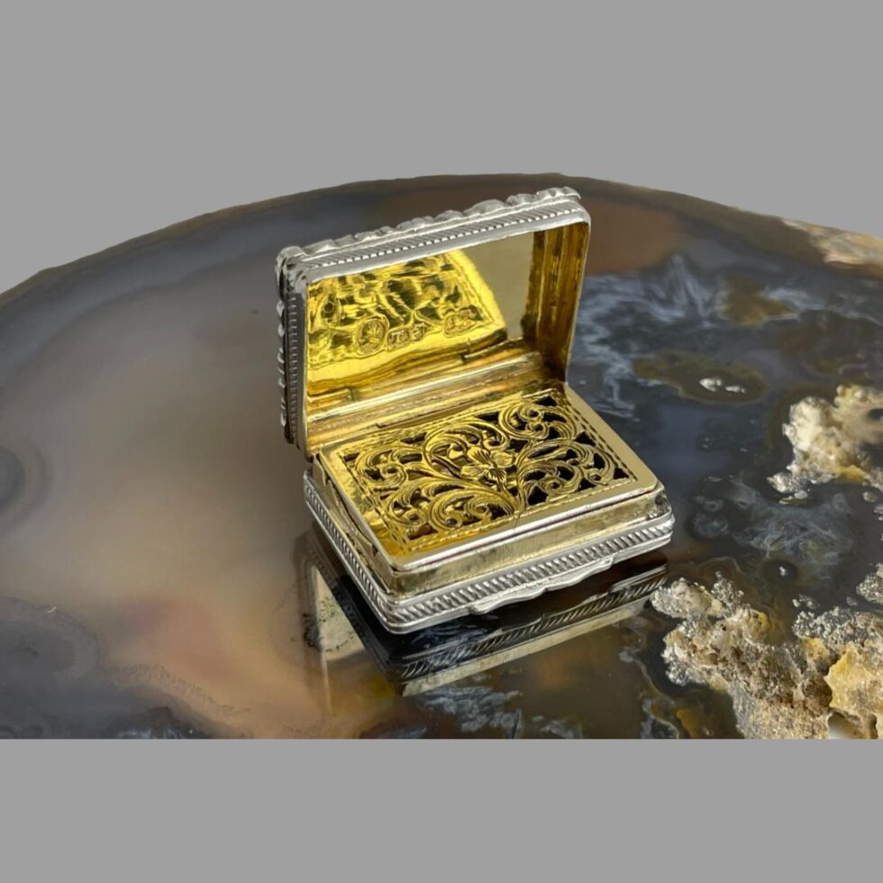 The Edward VII vinaigrette shown open revealing the gilt interior and grill cover which is closed.