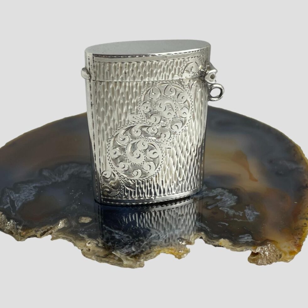 Photo of the back of the vesta showing the unusual scrollwork design