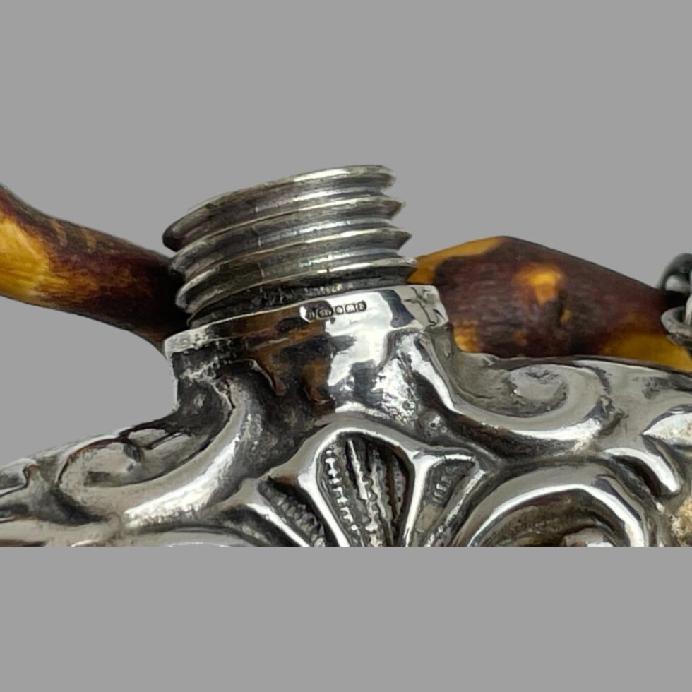 Close up photo of the tiniest hallmark possibly ever just below the screw top which has been removed here.