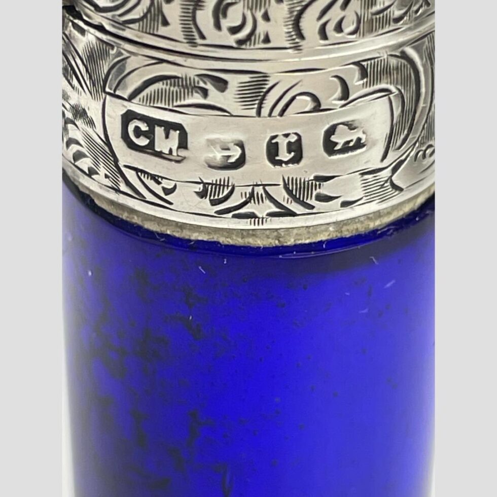 Close up photo of the full hallmark on the side of the silver top.