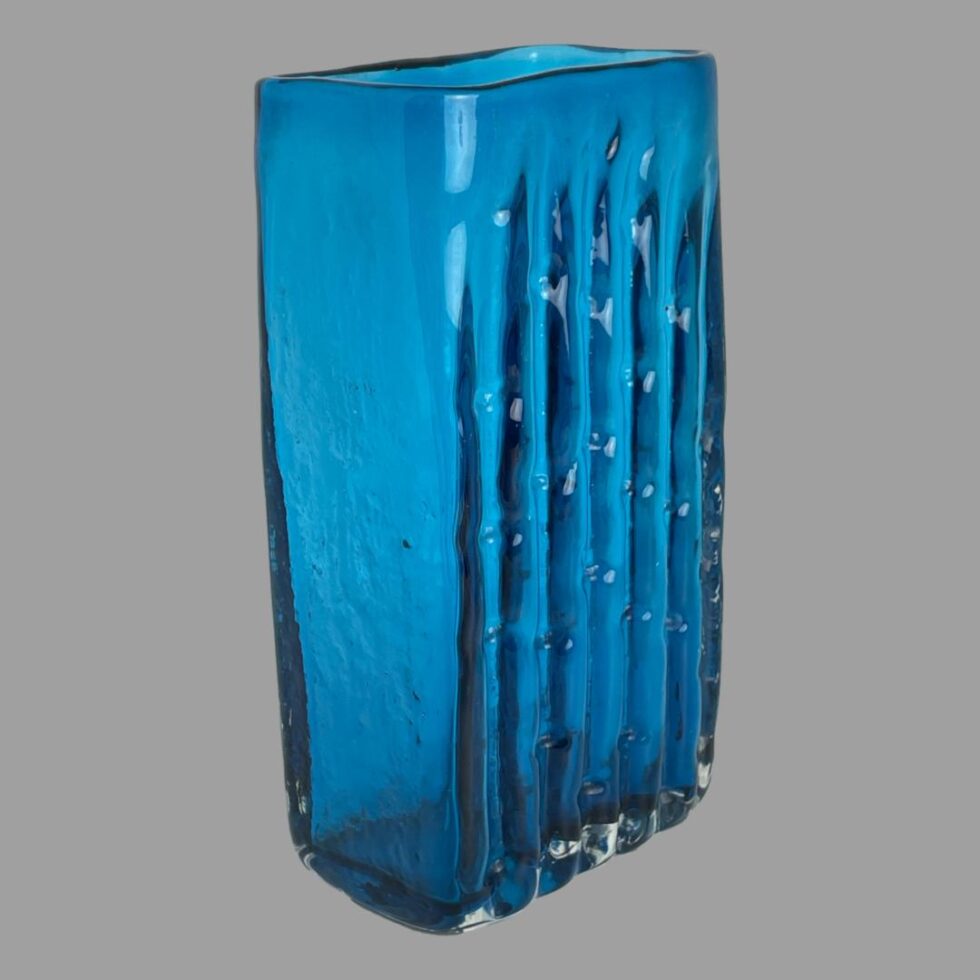 Photo of the Whitefriars bamboo vase this time displayed with the bamboo side facing the bottom right corner.