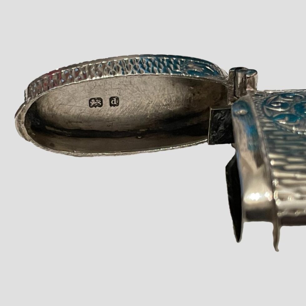 Close up photo of the short hallmark on the inside lid.