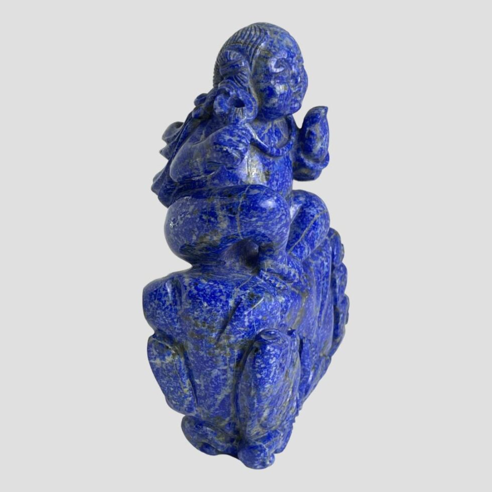 Photo of the carved Oriental figural sculpture this time facing to the bottom right corner.