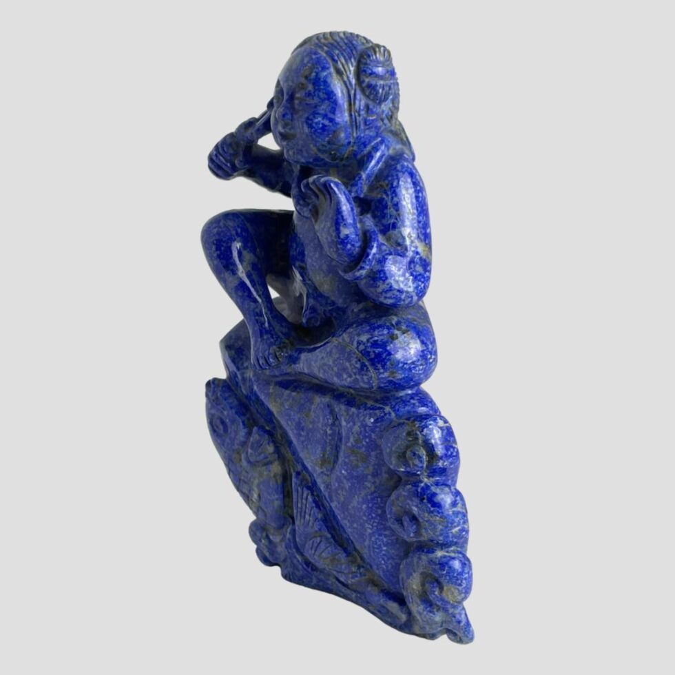 Photo of Oriental lapis sculpture now facing towards the bottom left corner.