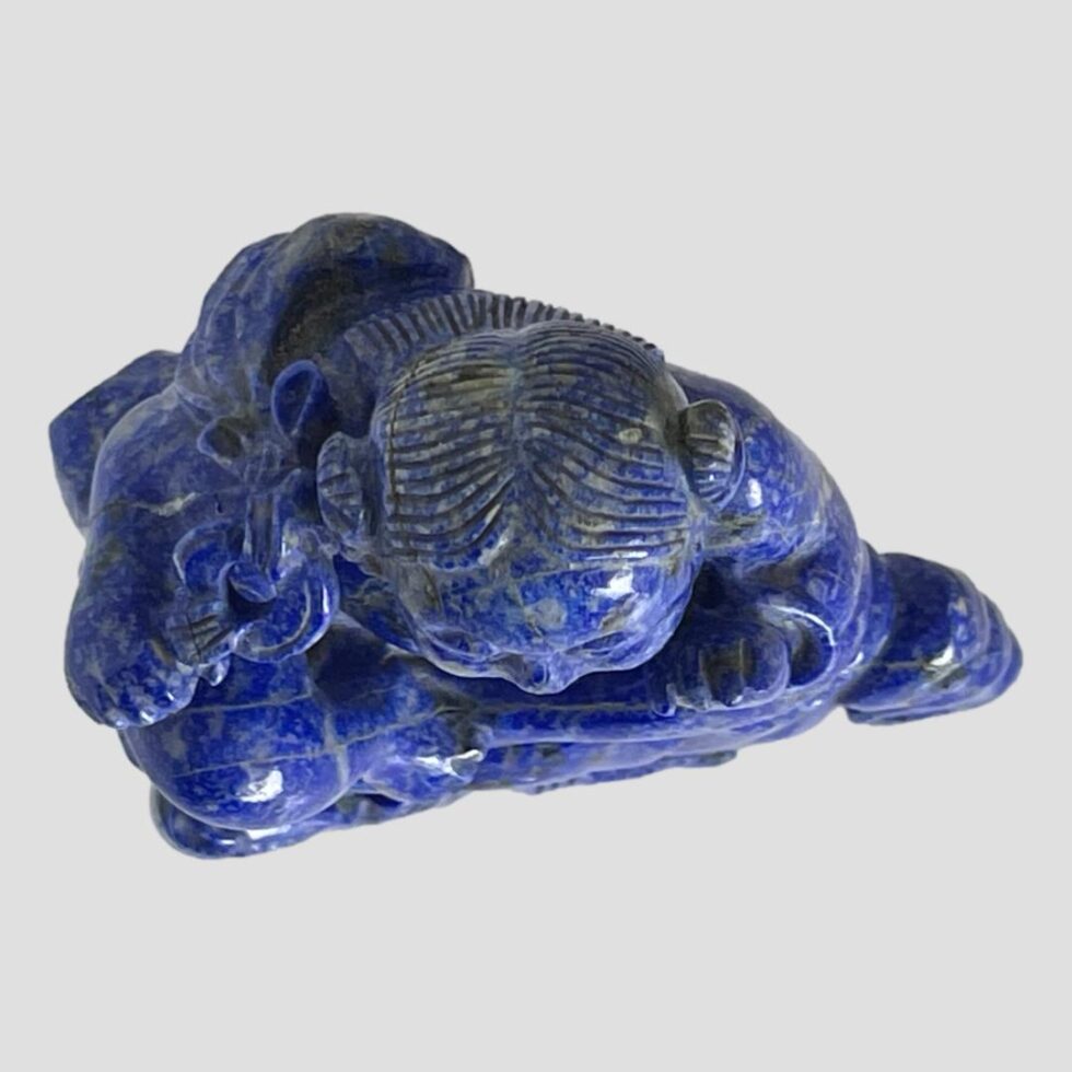 A photo looking down at the vintage Oriental figural sculpture from above.