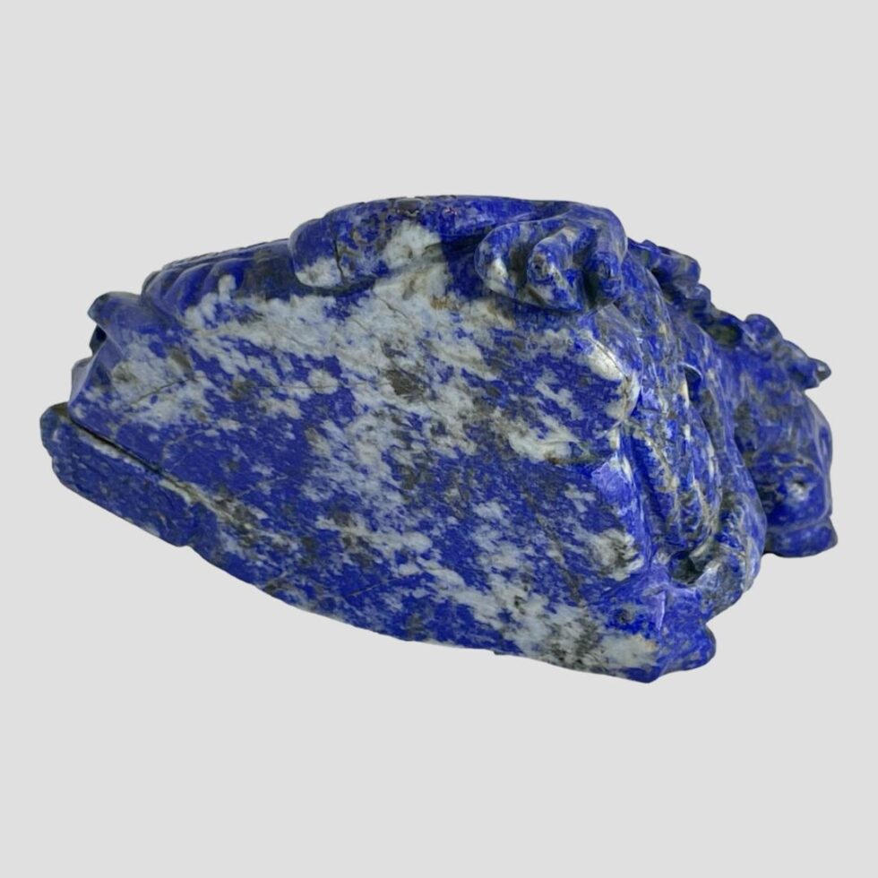 Photo of the base of the carved lapis dragon. The illegible signature is just visible in the bottom left.