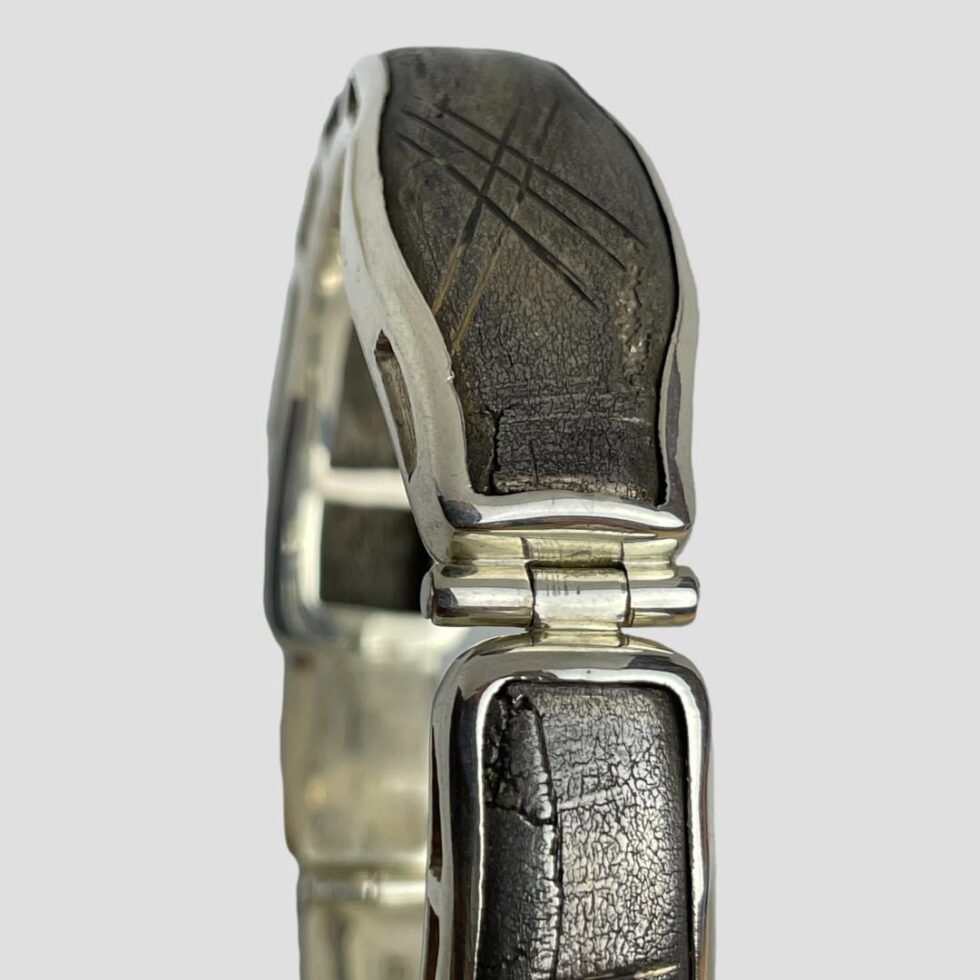 Close up photo of the hinged area of bracelet between the snakes head and tail.