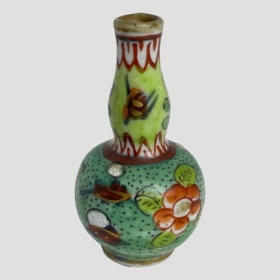 Another angle of the miniature Kangxi vase this time with the brightest of the red flowers on display.