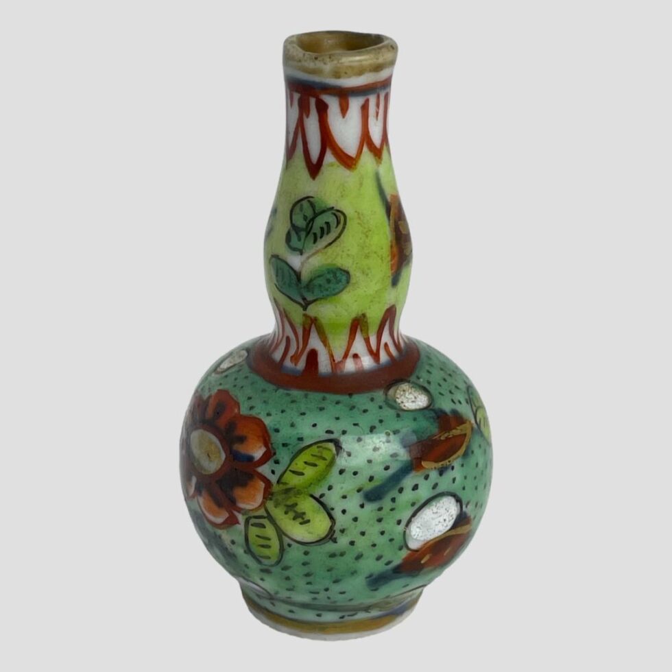 Photo of Kangxi miniature vase seen from another angle. This one is turned clockwise from the main photo. The floral theme continues throughout the design and each side has different floral pattern.