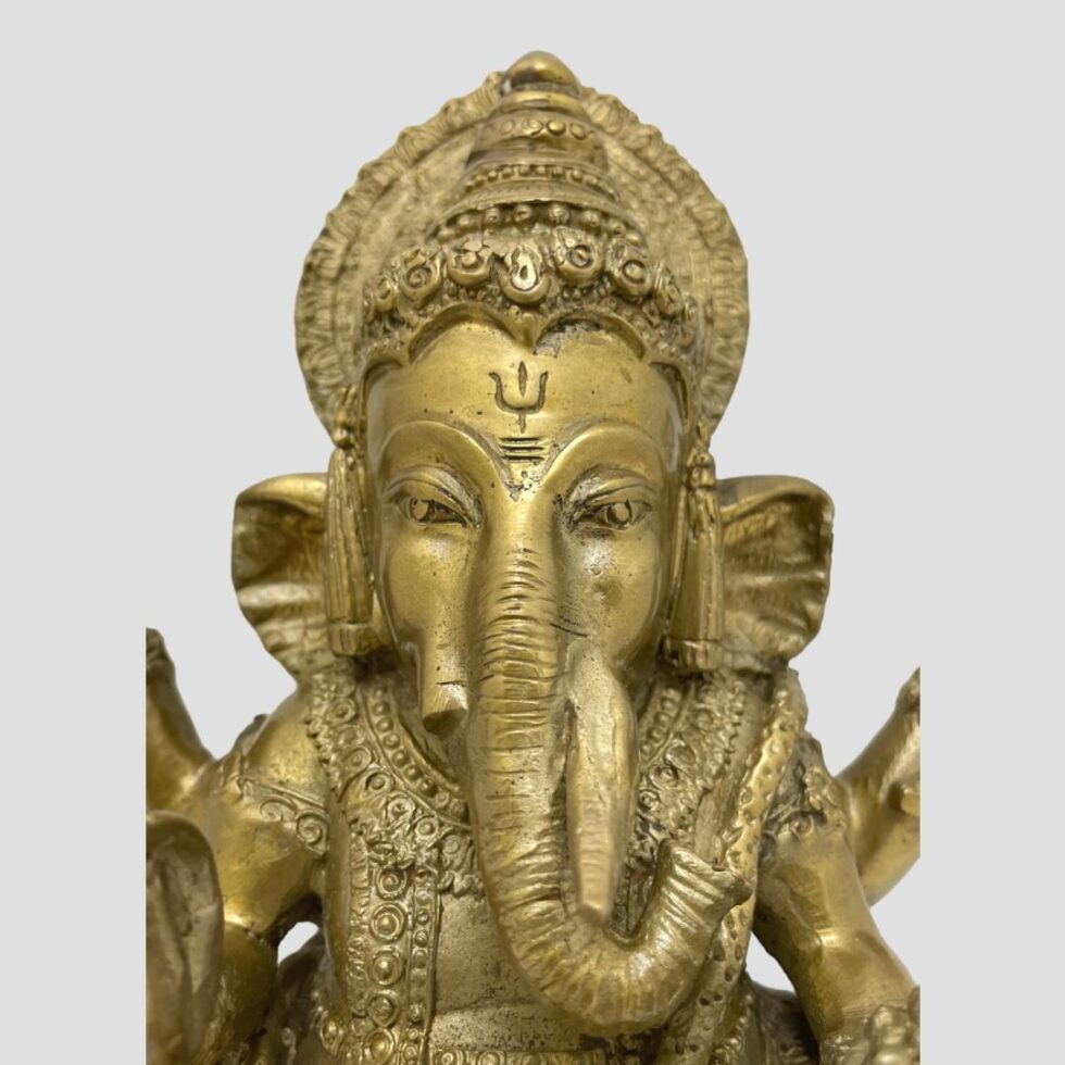 A close up photo of Lord Ganesh's head area.
