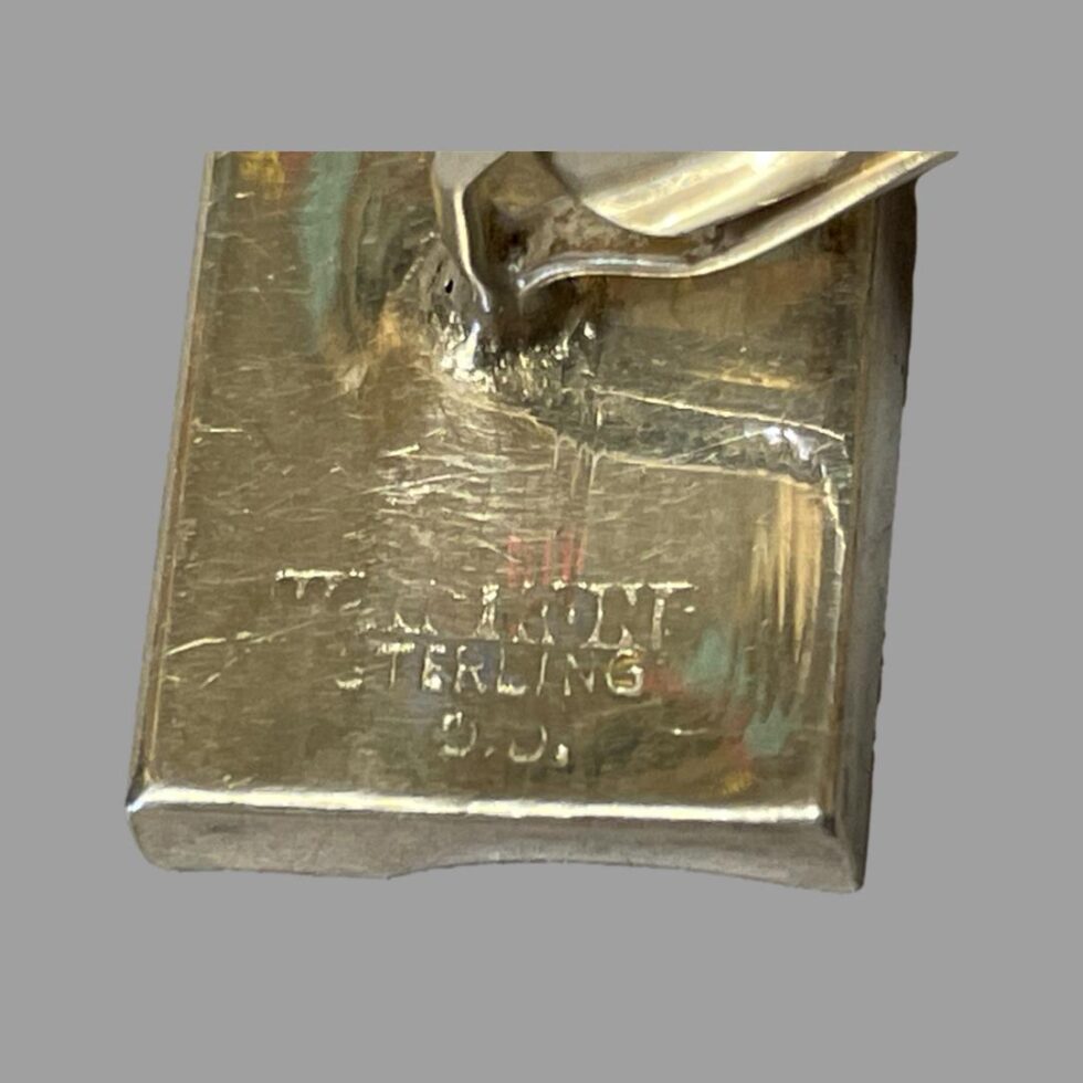 Close up photo of the sterling silver hallmark on the back of one of the abacus cufflinks.