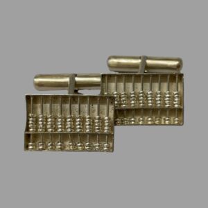 Main photo of 1960s silver abacus cufflinks shown from the front with one slightly in front of the other. These are proper working miniature silver abacuses with moving counters but you will need a pin or toothpick to use it! The bar toggle is visible at the back.