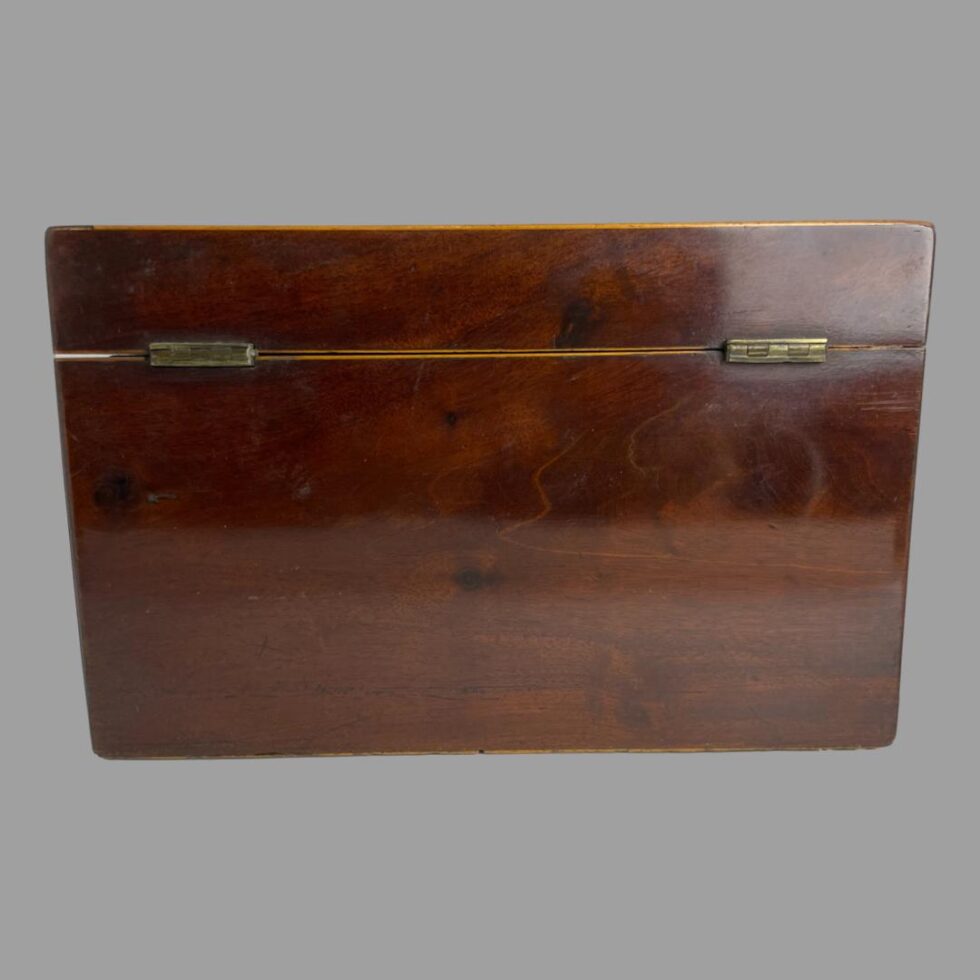Photo of the back of the small antique tea caddy.