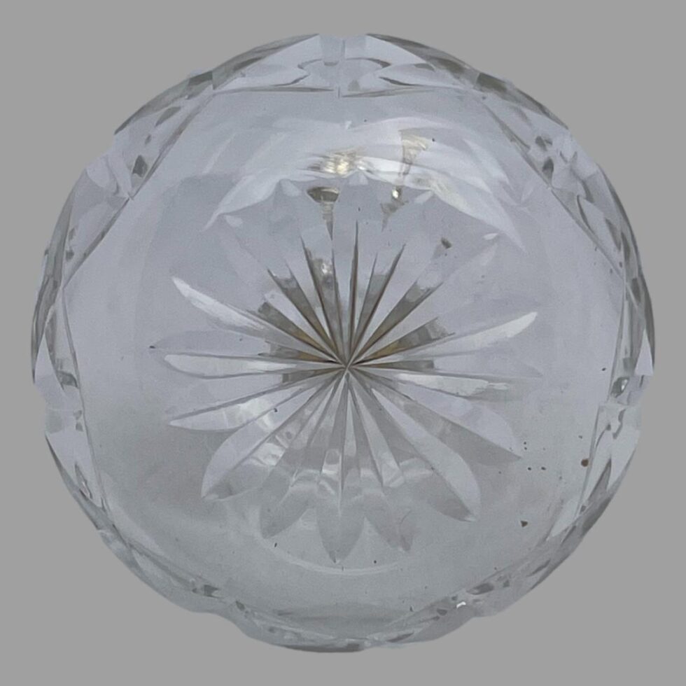 Photo of the base of the cut crystal bitters bottle showing the sunburst design.
