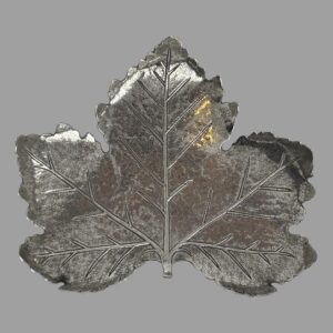 Main photo of silver leaf pin dish looking straight down at the full form from above. The leaf, a maple, is very realistic with the overall shape and the veins within the leaf. The tips of the leaf ends curl a little inward creating a natural leaf lip for the dish. Very high quality workmanship.