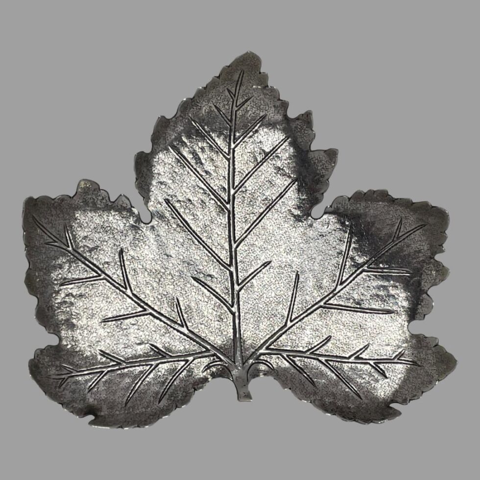 Another photo of the silver leaf pin dish this time with the light shining on it and highlight the veins of the leaf.