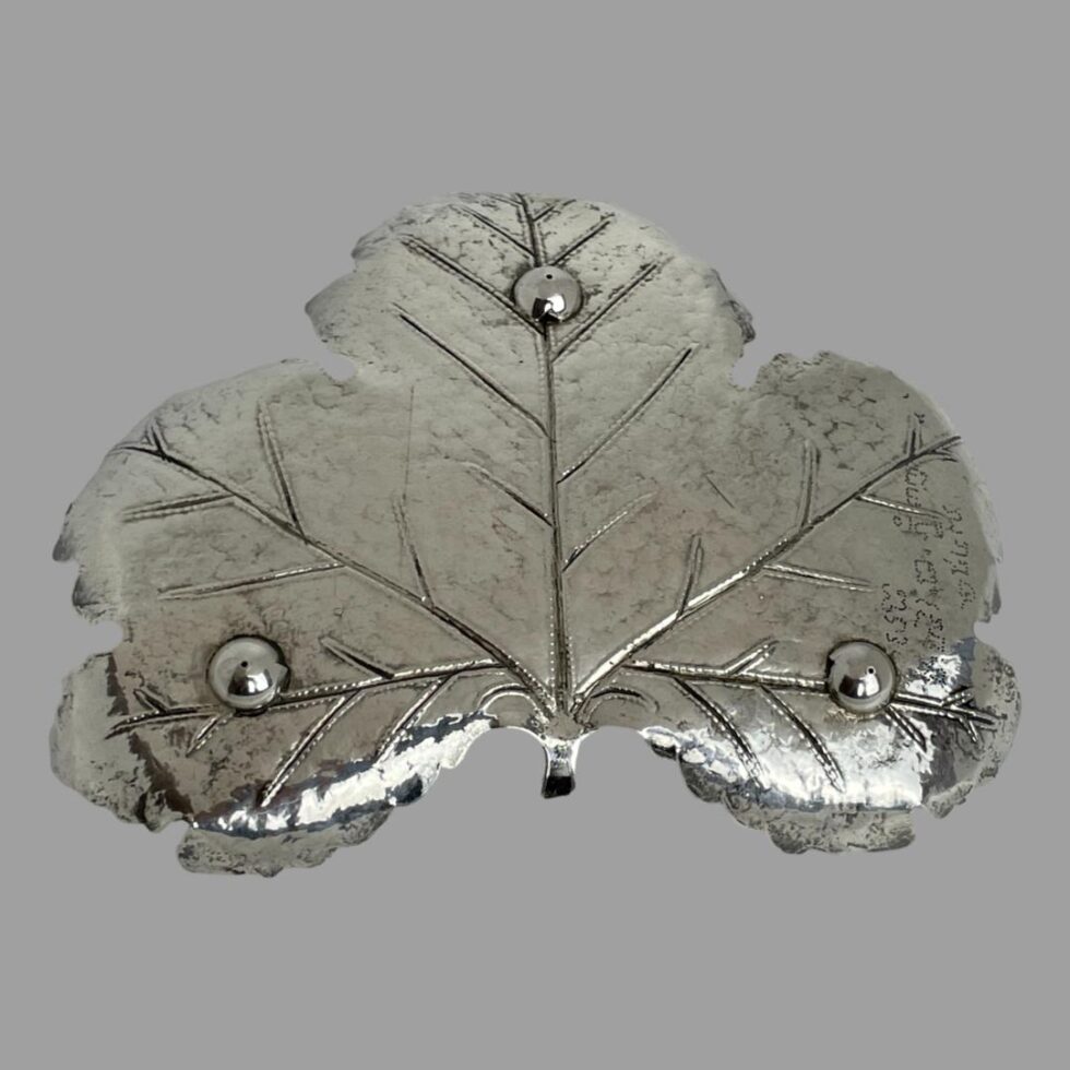 Photo of the base of the silver maple leaf pin dish showing the 3 ball feet.