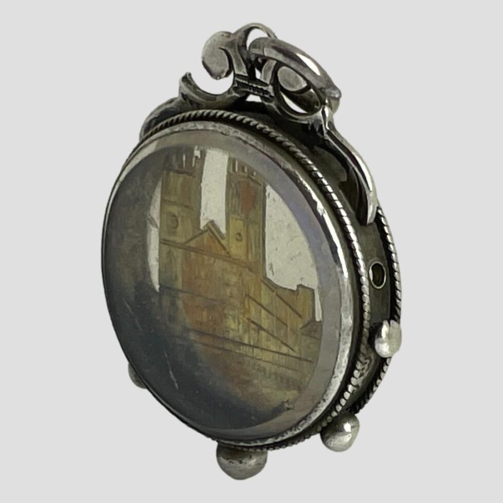 Photo of Westminster Abbey fob displayed upright with one side facing to the bottom left corner