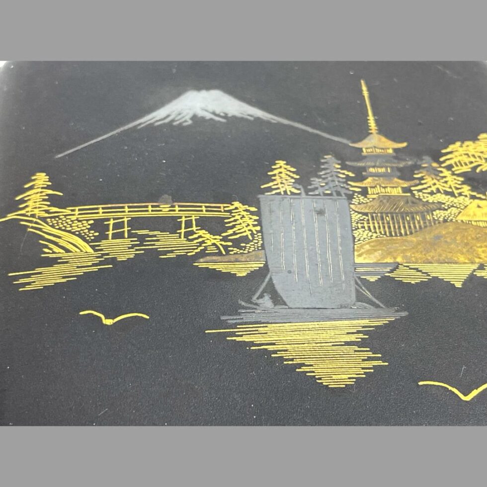 Close up photo of the inlaid scene design.