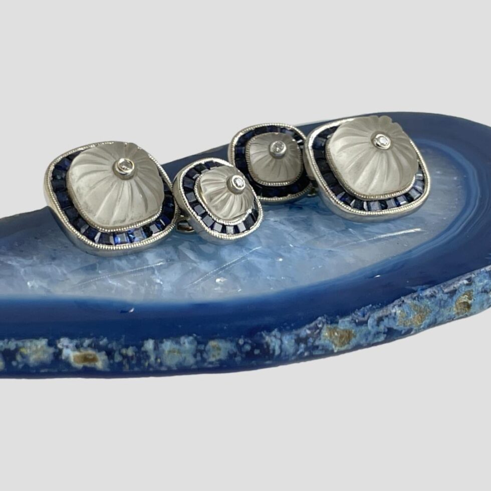 Photo of both cufflinks displayed on top of a small slice of blue agate with all 4 squares facing forward and upward to the top right corner. The lovely design features of these lovely cufflinks are very visible and the craftmanship is outstanding.