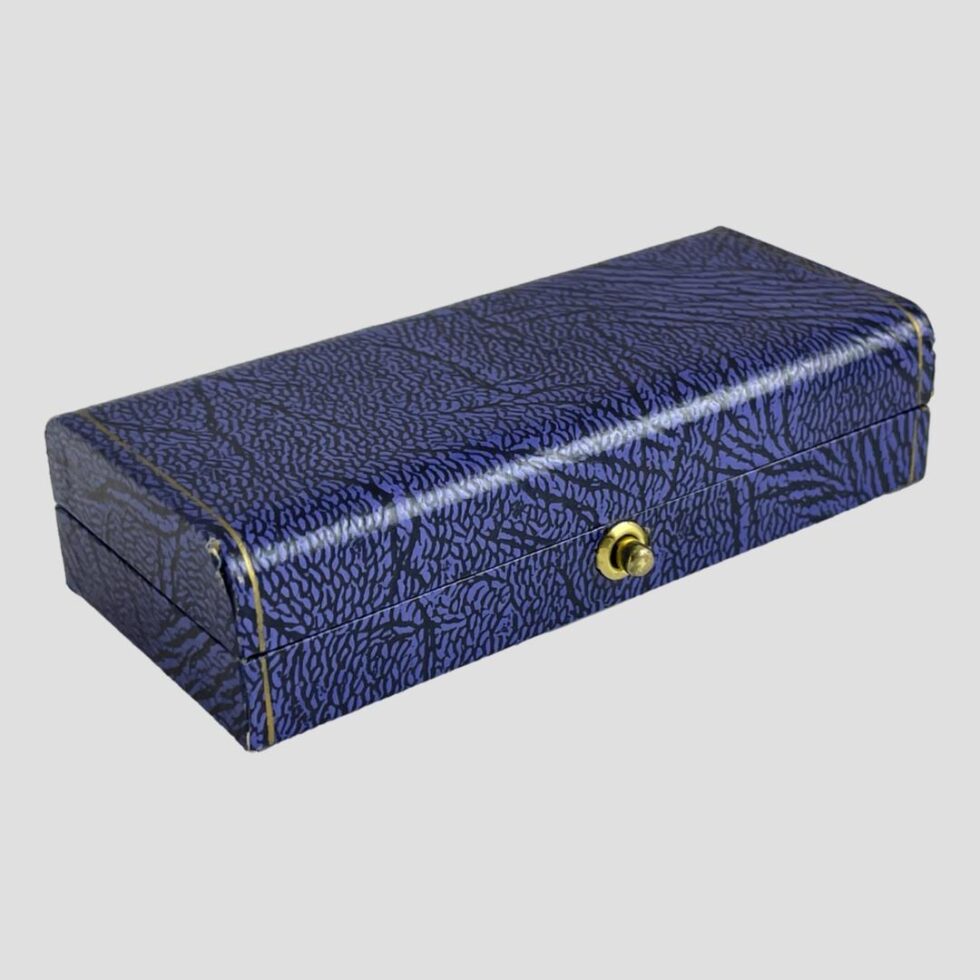 Photo of the closed and very neat, blue Garrard & Co cufflink box. There is a very minor split to one corner on outside otherwise in very good condition.