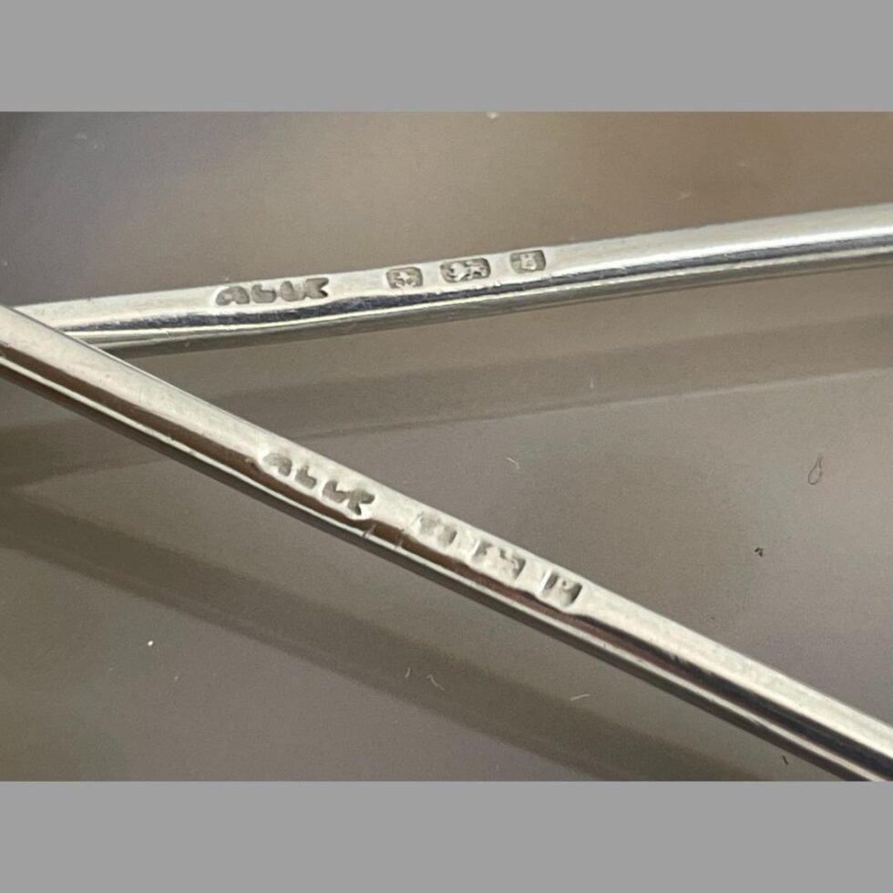 Close up photo of the full hallmarks on the slim handle of both forks.