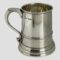 Main photo of silver half pint tankard displayed with the handle on the left and the full hallmark visible on the top right of handle. The tankard is slightly flared at the base making it a sturdy holder of your favourite beer, ale, stout or cider even. The tankard is in very good condition with no damage - almost like it has never been used. Lovely gift item to someone who'll appreciate quality or, as a gift to yourself!