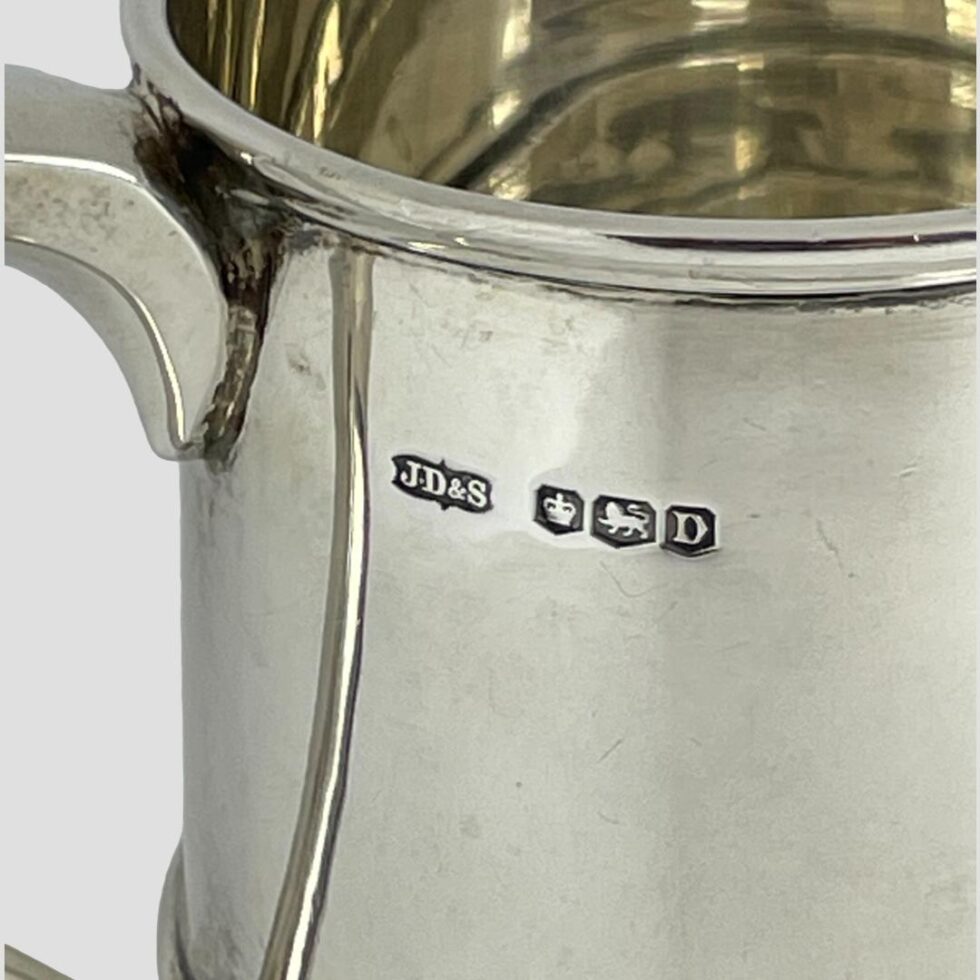 A close up photo of the full hallmark to right of handle top.