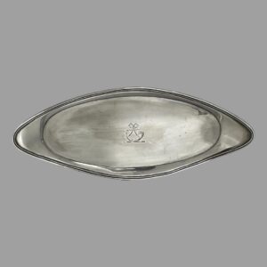 Main photo of George III snuffer tray displayed horizontally upright to show the shape of the tray which is an elongated oval with turned up or raised border. It is almost an eye or almond shape. The crest at the centre is visible which is a ribbon with what looks like a hunters horn of a stand (could be an old hearing aid horn!) Not a lot of use for snuffer trays these days but this could be utilised as an stick incense burner stand as it is long enough. Whatever you decide to use it for, it will be a useful and practical (as well as collectable) item of antique silver.