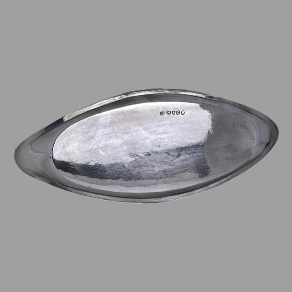 Photo of the base of snuffer tray with the hallmark visible at the top.