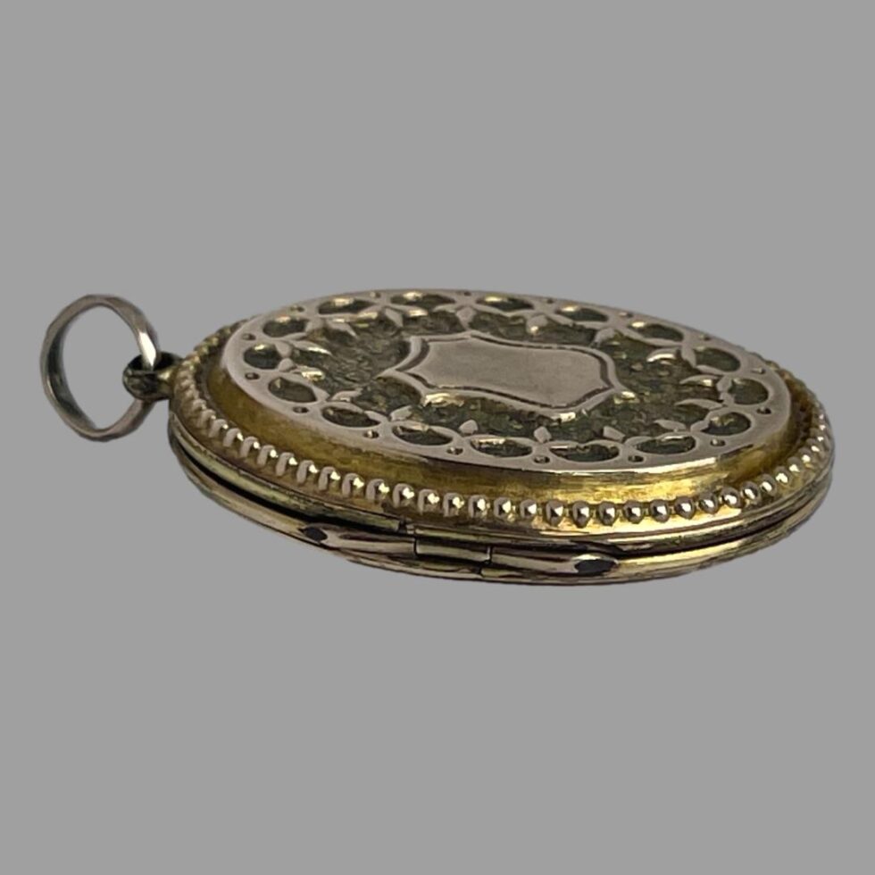 The locket is laid flat to show the depth.