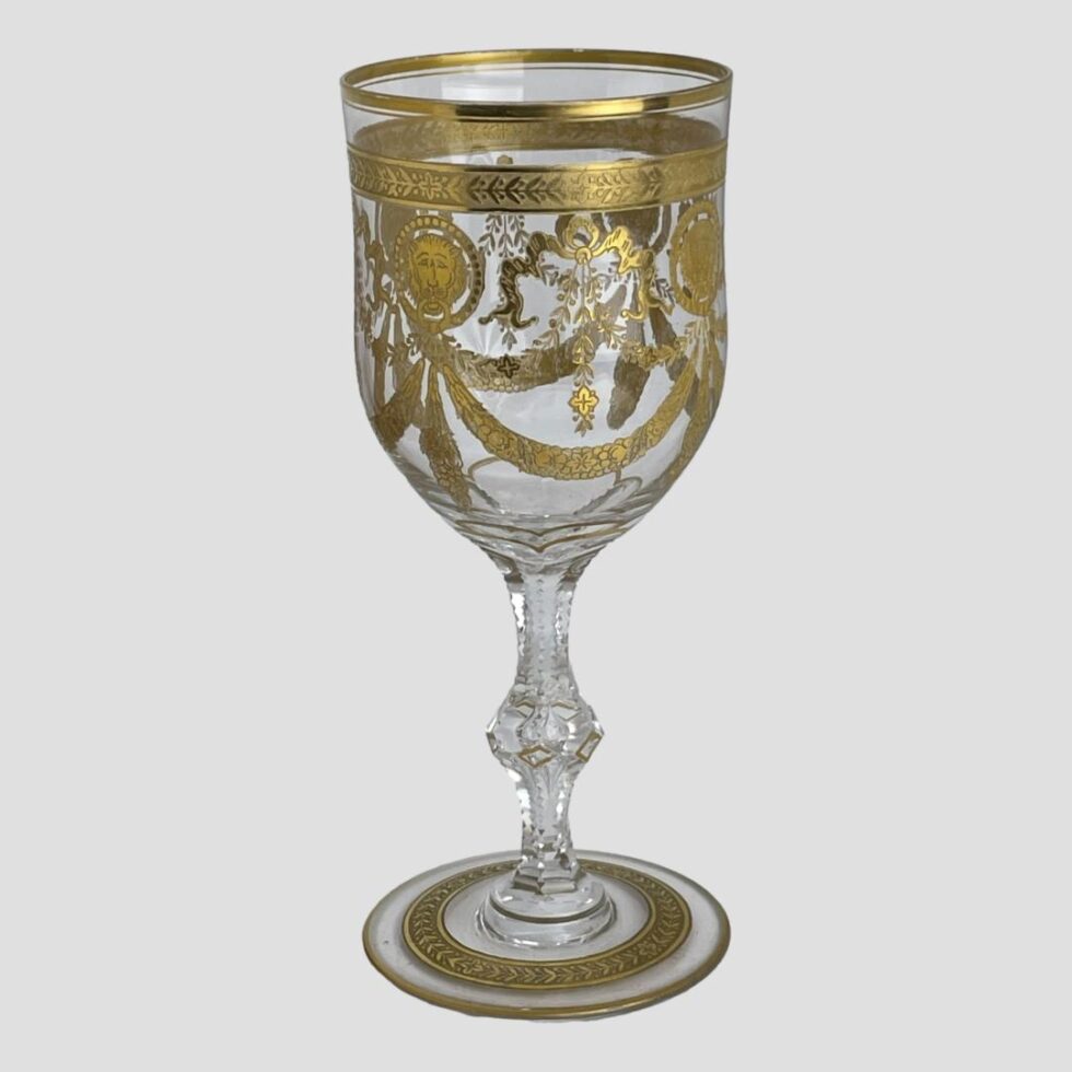 Main photo of St Louis Congress goblet seen from almost an eye level in its entirety. The side displayed shows the swag at centre with lions head discs either side. This is a very grand glass and would require some grand burgundy to put it into good respectful use!