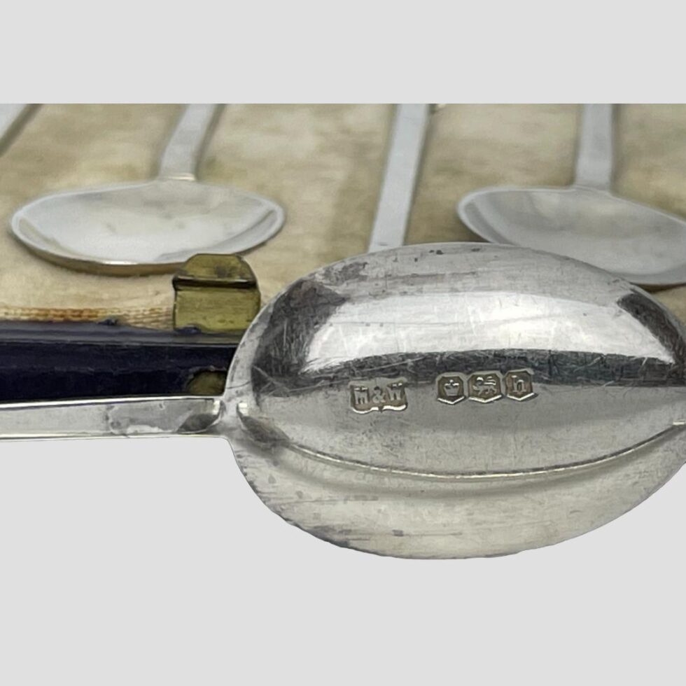 Close up photo of the hallmark on the back of the spoon bowl.