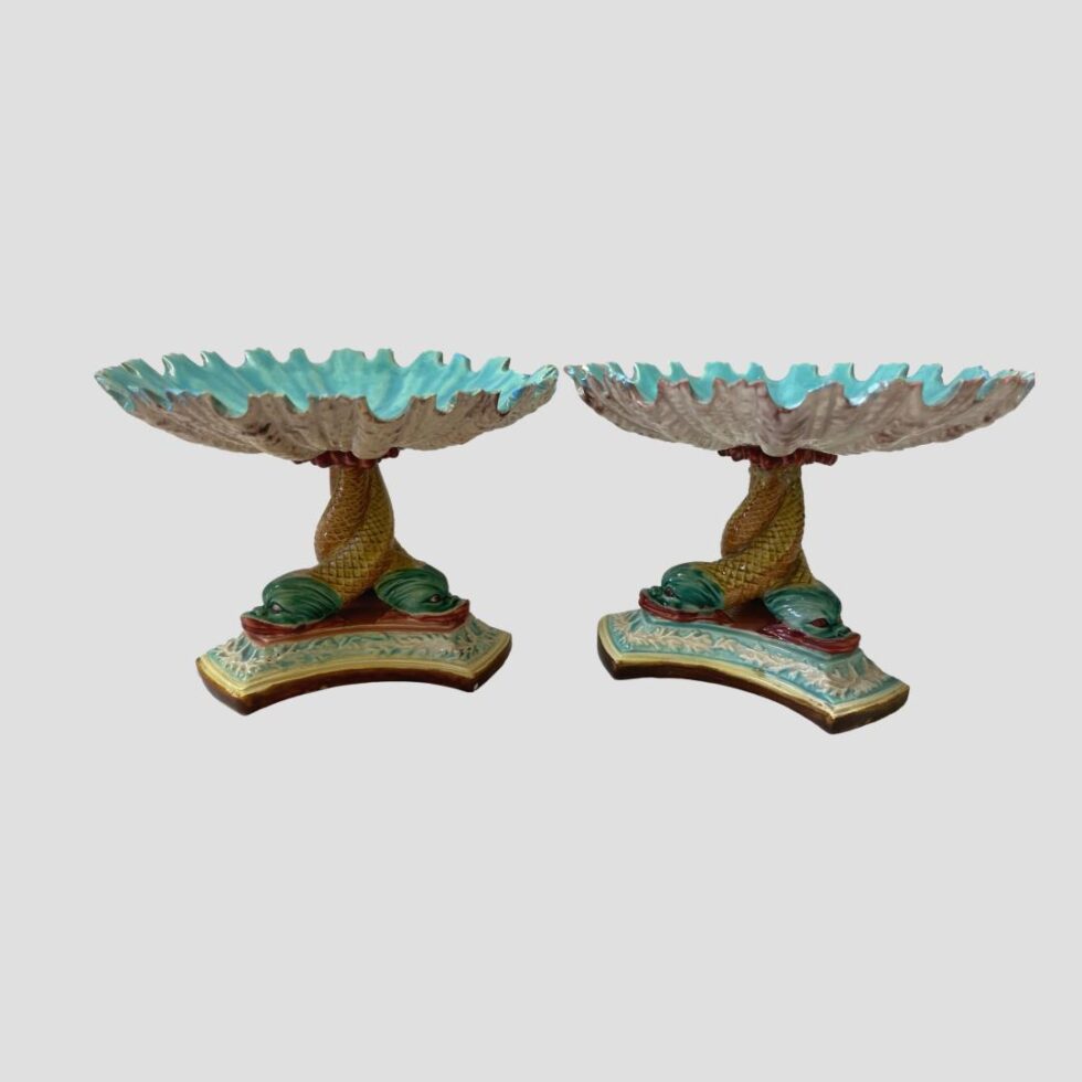 Photo of the Art Nouveau sweetmeat dishes displayed side by side with the angle very slightly above eye level showing a peek view of the beautiful turquoise inside of the scallop shaped bowls at top.