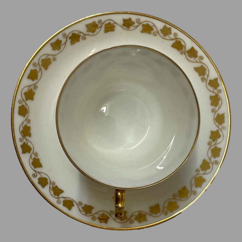 Photo looking straight down into the cup from above. The cup is on top of the saucer. Bother cup and saucer are very clean with little to no signs of wear.