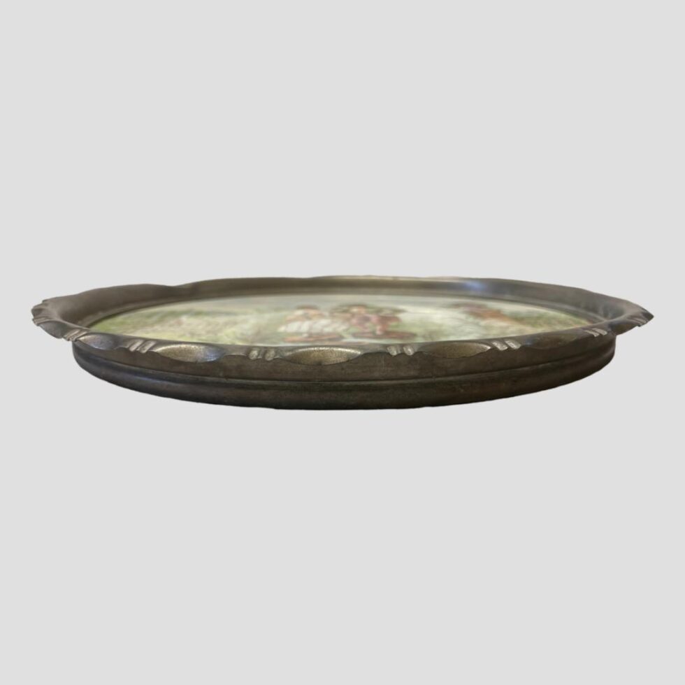 Photo of the Limoges tray seen laid flat and from an eye level to show the height of the metal rim. It would be nice to get the metal shined up a little or gilded.