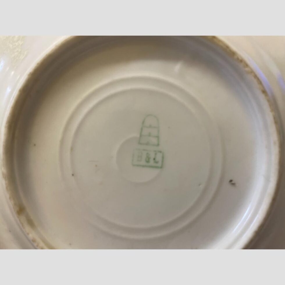 Close up photo of the beehive stamp and B&L mark on the base of one of the plates.