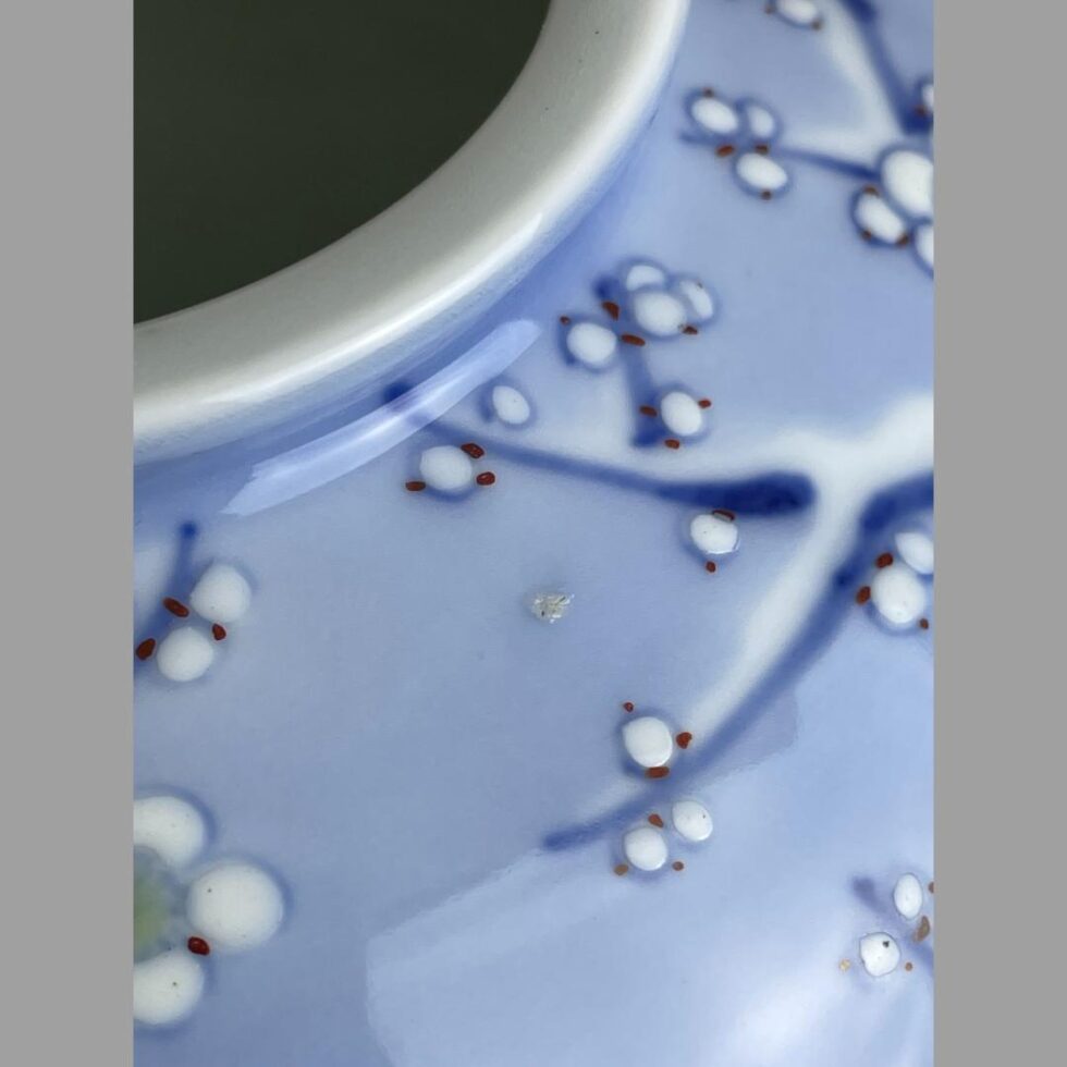 Close up photo of the small mis-glaze dot at the top of the vase.