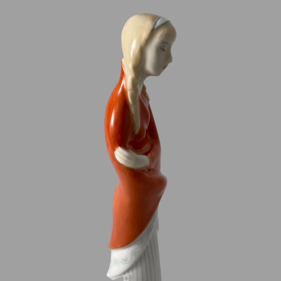 Photo of teenager by Doulton this facing straight right and from the hip up.