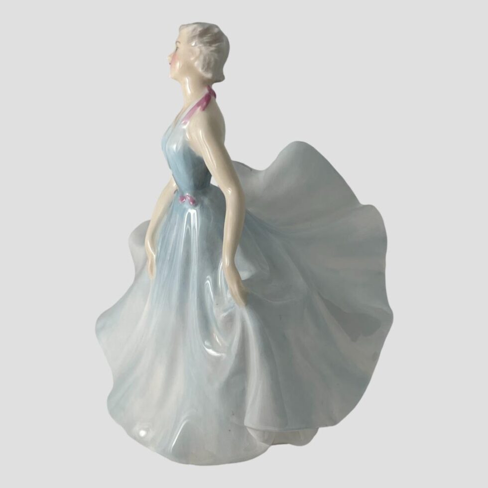 Photo of Doulton pirouette figure shown from a side angle facing to the left.