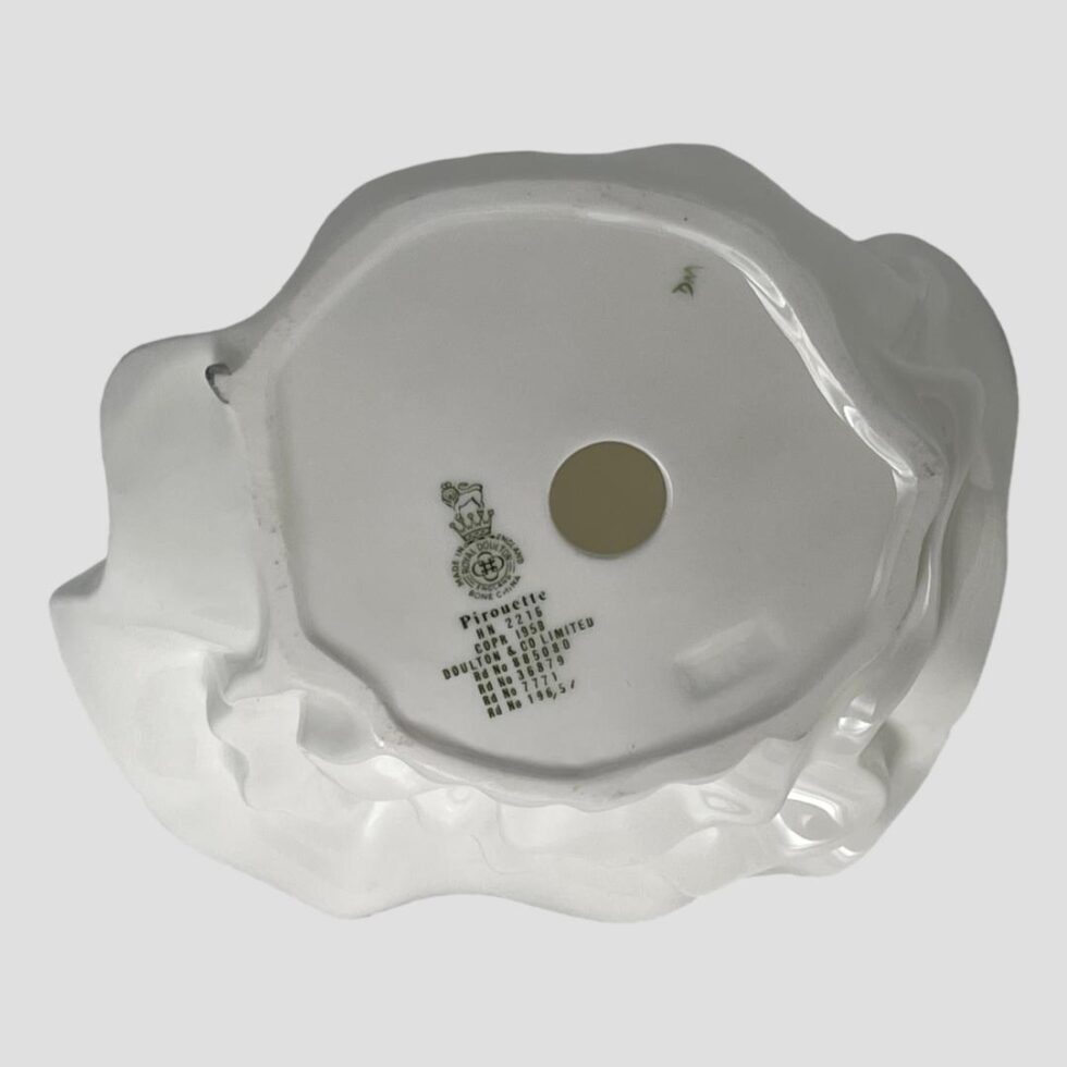 Photo of the base of the pirouette figure showing the Doulton marks and model name and number 'Pirouette HN2216'