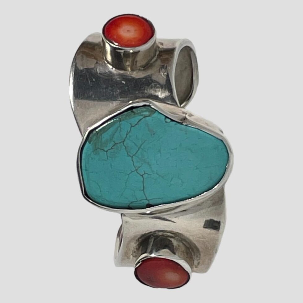 Photo of Mexican wave cuff displayed on its side with the front forward facing. The bracelet is thick enough to stand this way on its own.