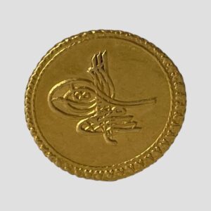 Main photo of Ottoman Empire gold coin displayed with the obverse with imperial monogram on show. The coin has an interesting embossed outer edge. The colour of the gold confirms its higher fine quality of 22 karat plus.