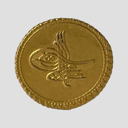 Main photo of Ottoman Empire gold coin displayed with the obverse with imperial monogram on show. The coin has an interesting embossed outer edge. The colour of the gold confirms its higher fine quality of 22 karat plus.