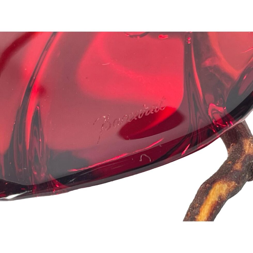A close up photo of the Baccarat signature to the back of the heart pendant.