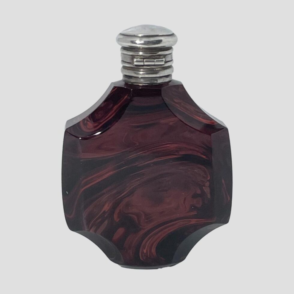 Photo of the back of the Antique French scent bottle this time with the hinged back area of the lid on display.