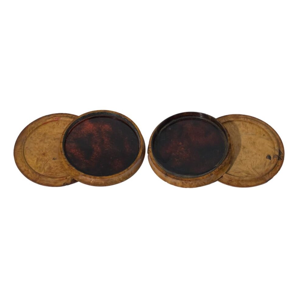 The 2 tortoiseshell like sides of the middle compartment on display with the inside of the wooden lid and base also on display.