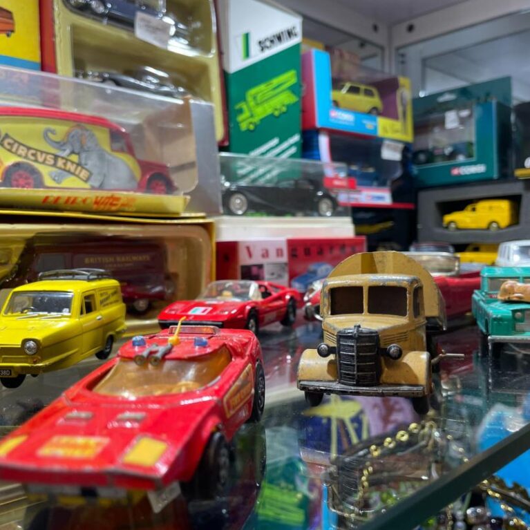 A selection of vintage toy cars for the Collectables category.