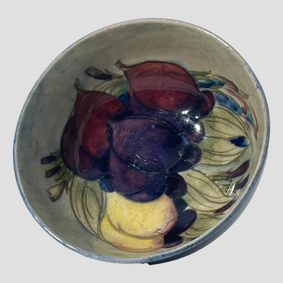 Another photo of the wisteria pattern inside the small footed Moorcroft bowl this time turned very slightly to left and out of lights glare.