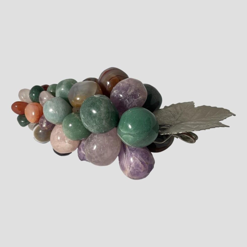 Photo looking at the grapes from the top end, the leaf is moveable but here is seen to the centre right. At the top of the bunch are some large green aventurine stone grapes and amethysts.